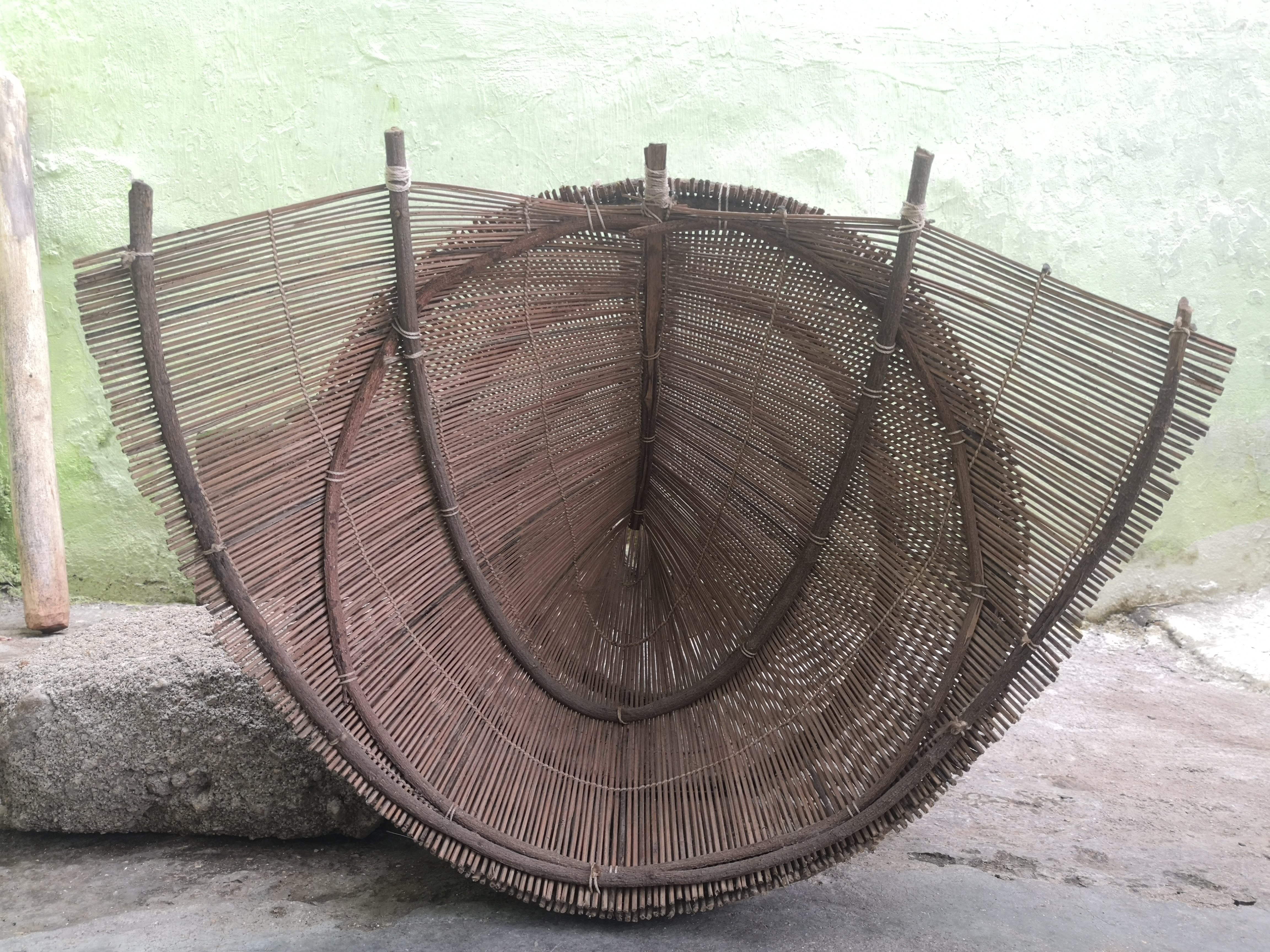Traditional woven bamboo fishing basket